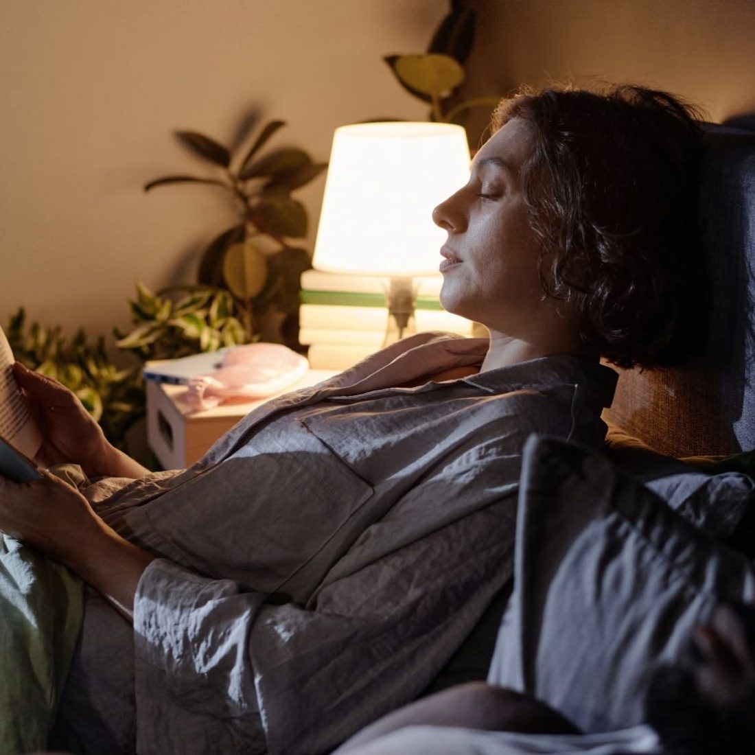 Peaceful rest by a warm bedside lamp