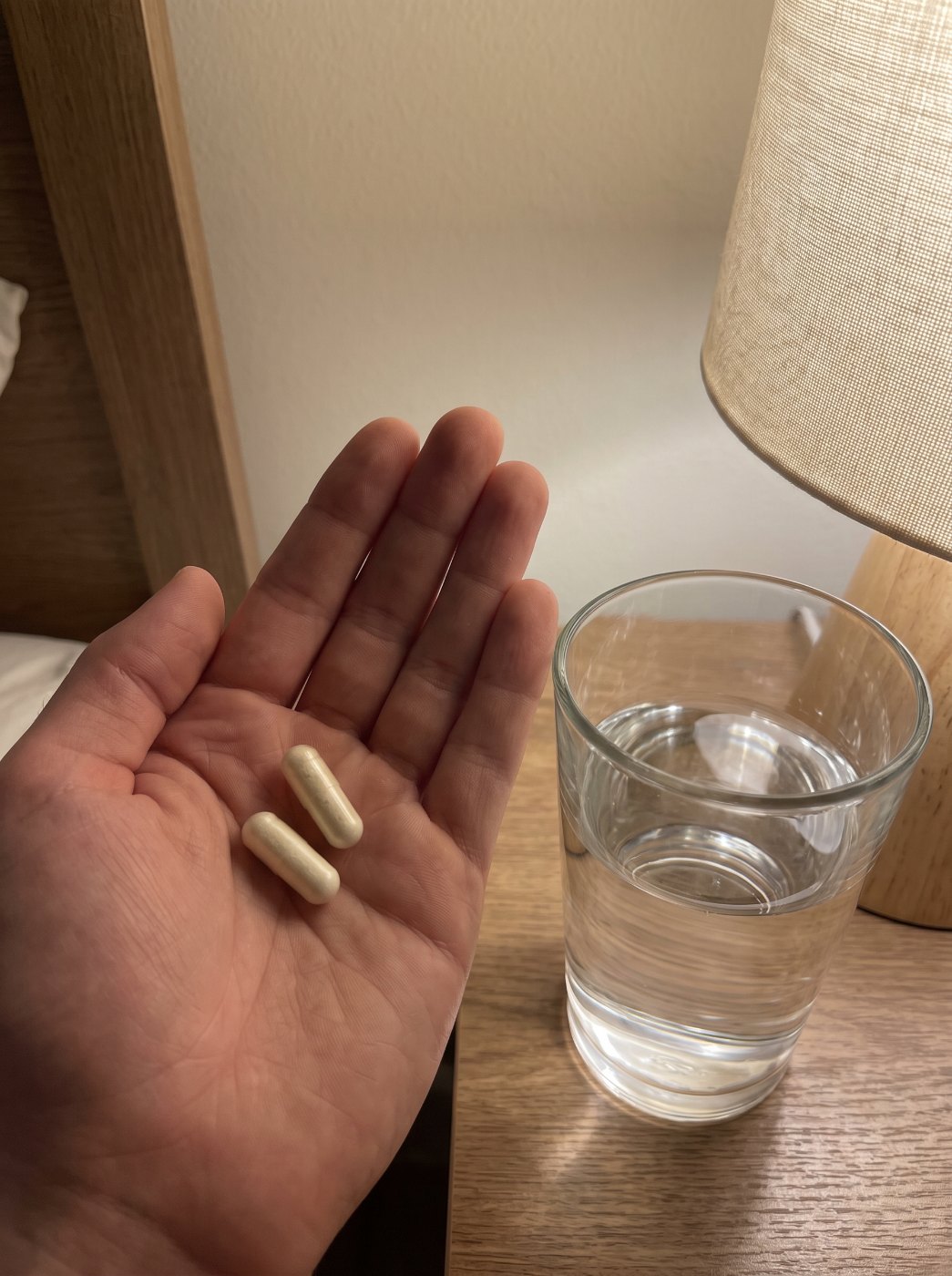 Two Lantern Rest capsules and a glass of water
